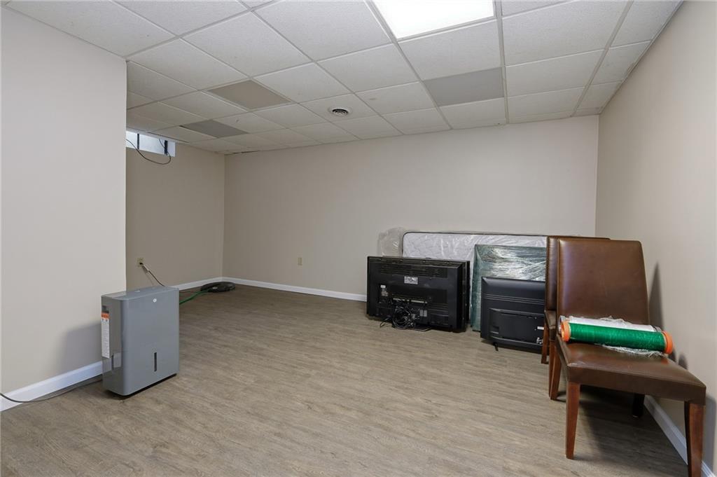 690 Pearce Mill Road Wexford, PA 15090 - Photo 24 of 38 a room with furniture and a flat screen tv