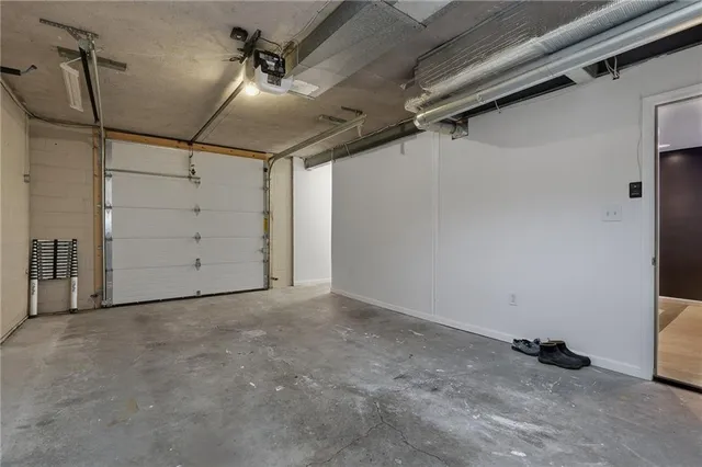 a view of a house with wooden fence