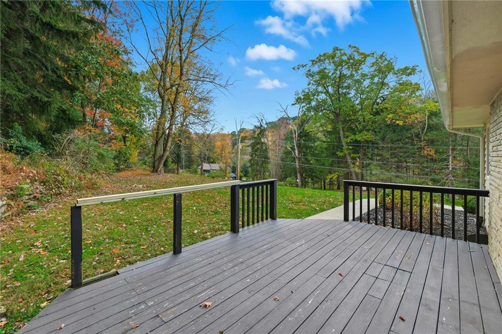 690 Pearce Mill Road Wexford, PA 15090 - Photo 33 of 38 a view of a deck with wooden floor and fence next to a yard