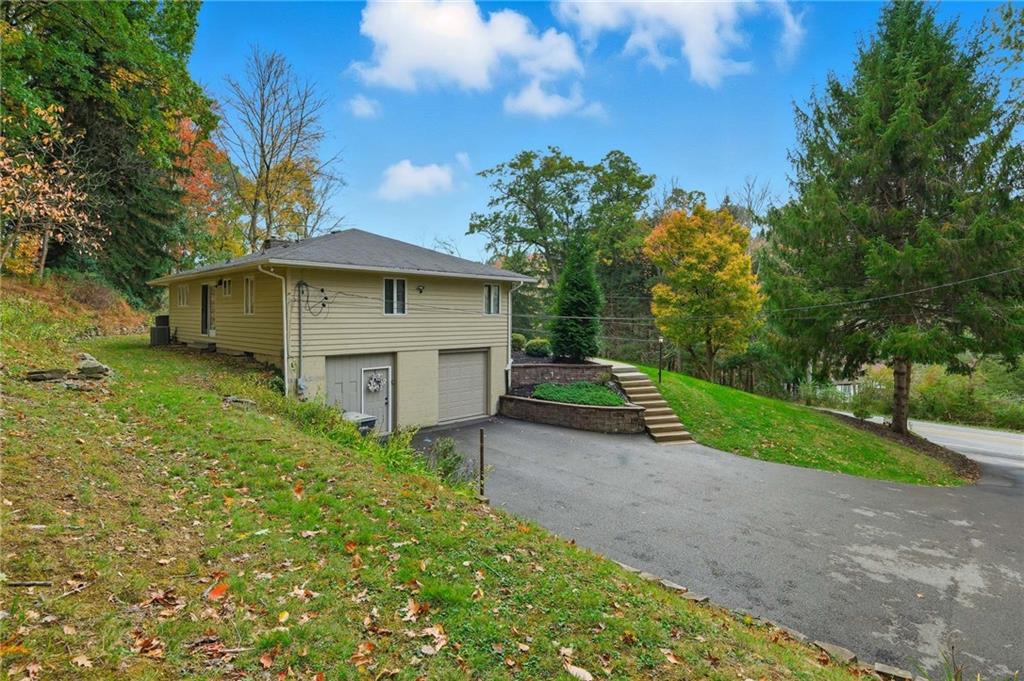 690 Pearce Mill Road Wexford, PA 15090 - Photo 37 of 38 a house with green field in front of it