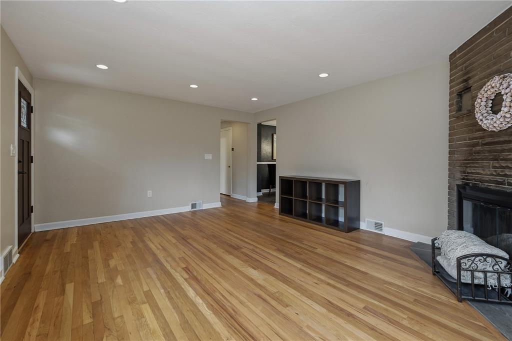690 Pearce Mill Road Wexford, PA 15090 - Photo 5 of 38 a view of a livingroom with wooden floor and a fireplace