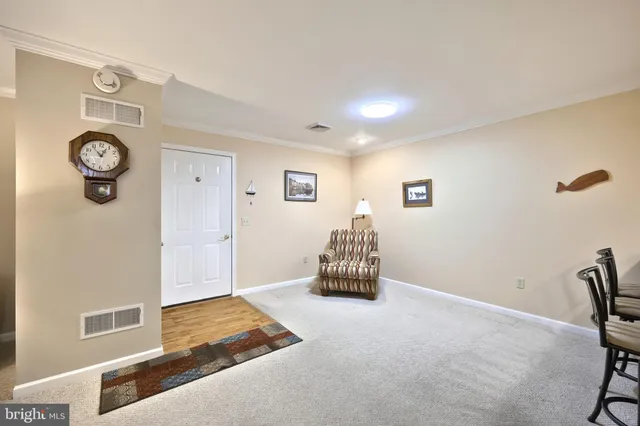 a view of livingroom with furniture and workspace