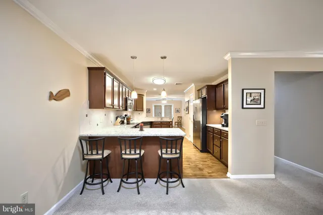 a kitchen with lots of counter top space sink and cabinets