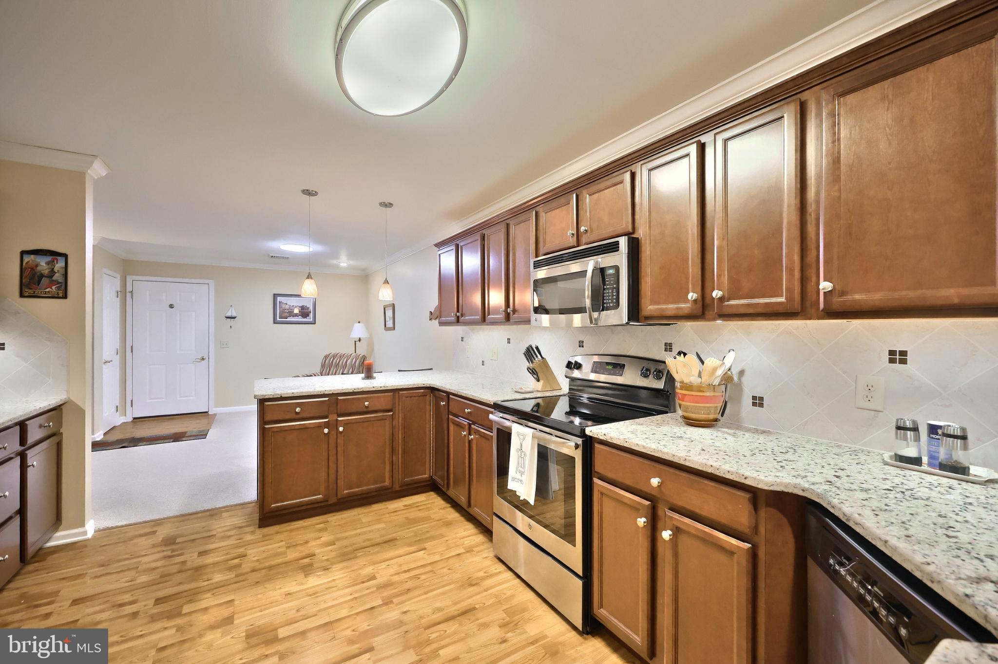 121 Furlong Way, Unit 121 Red Lion, PA 17356 - Photo 14 of 31 a kitchen with stainless steel appliances granite countertop a sink stove cabinets and refrigerator