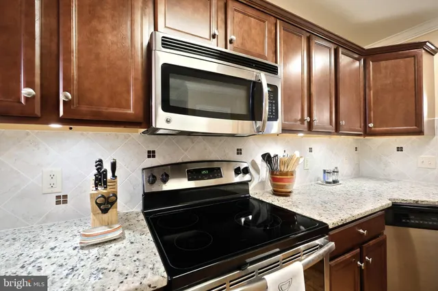 a kitchen with a refrigerator and cabinets