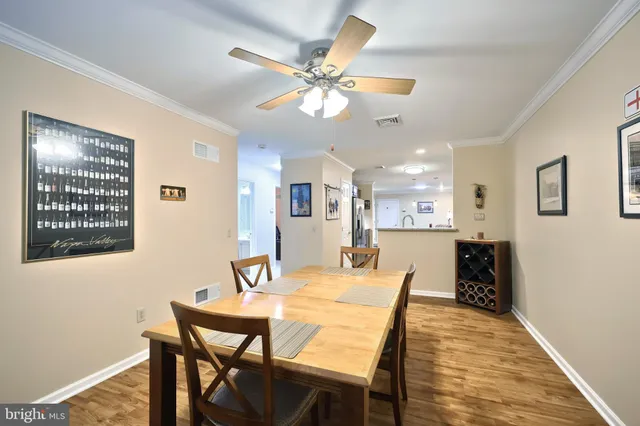 a spacious bedroom with a bed and a chandelier