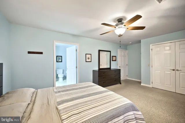 a bathroom with a sink mirror and vanity