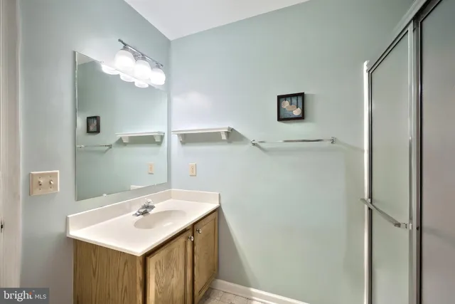 a white toilet sitting next to a bathroom sink