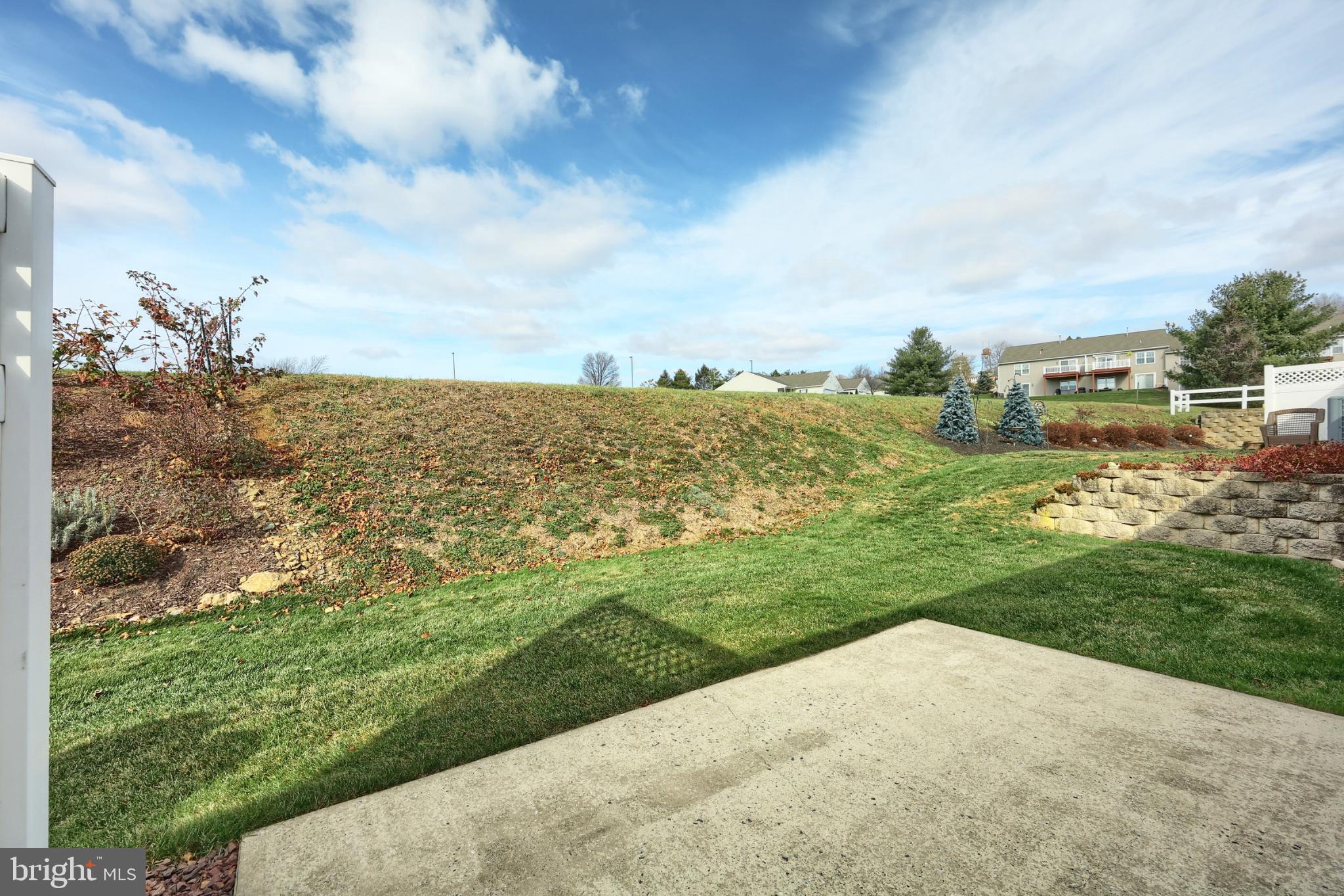 121 Furlong Way, Unit 121 Red Lion, PA 17356 - Photo 29 of 31 a view of a yard with an ocean view