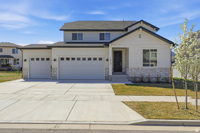 1353 Mapleton Hts Court Mapleton, UT 84664 - Photo 49 of 50 Traditional-style house with a front yard, stone siding, concrete driveway, and a garage