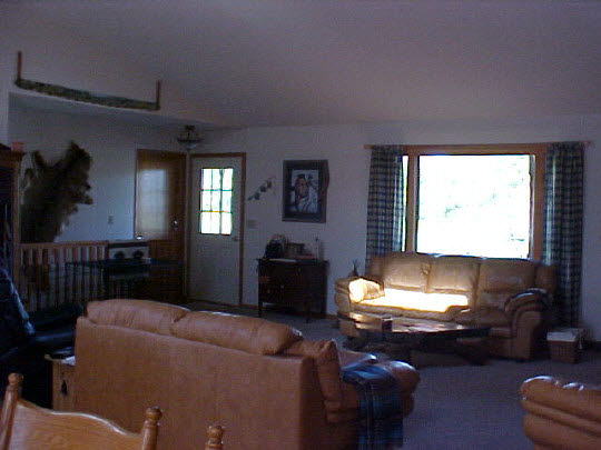 3930 North Marrill Road Byron, IL 61010 - Photo 5 of 6 a living room with furniture fireplace and a window