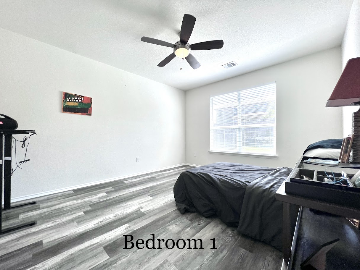 7900 Crystalbrook West Austin, TX 78724 - Photo 22 of 27 a bedroom with a bed and a window
