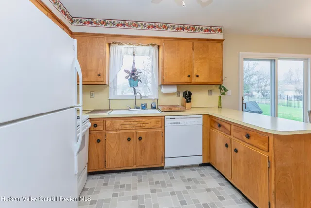 a spacious bathroom with a double vanity sink a mirror and a bathtub