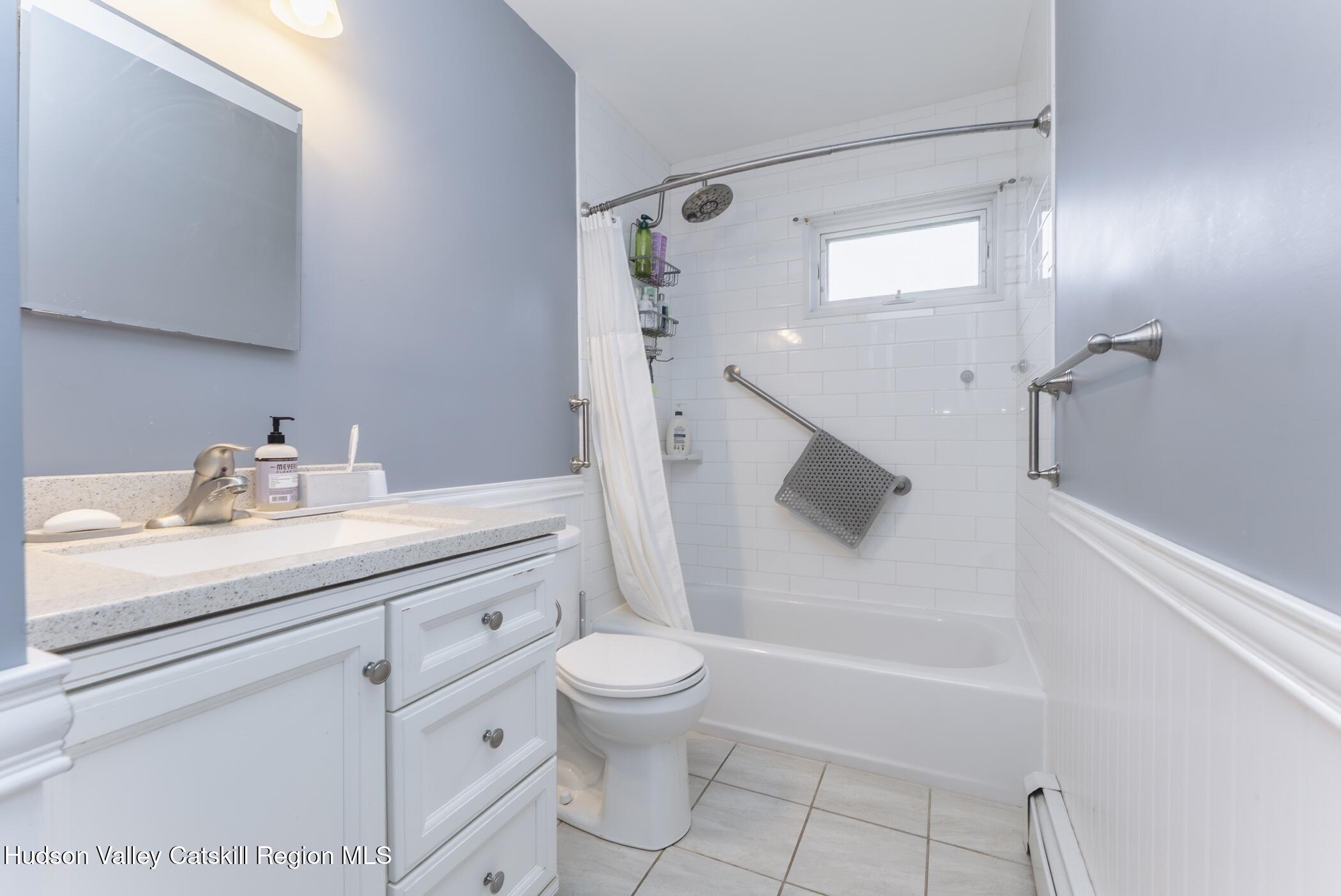121 Rayna Street Hurley, NY 12443 - Photo 21 of 41 a bathroom with a granite countertop sink a toilet and shower