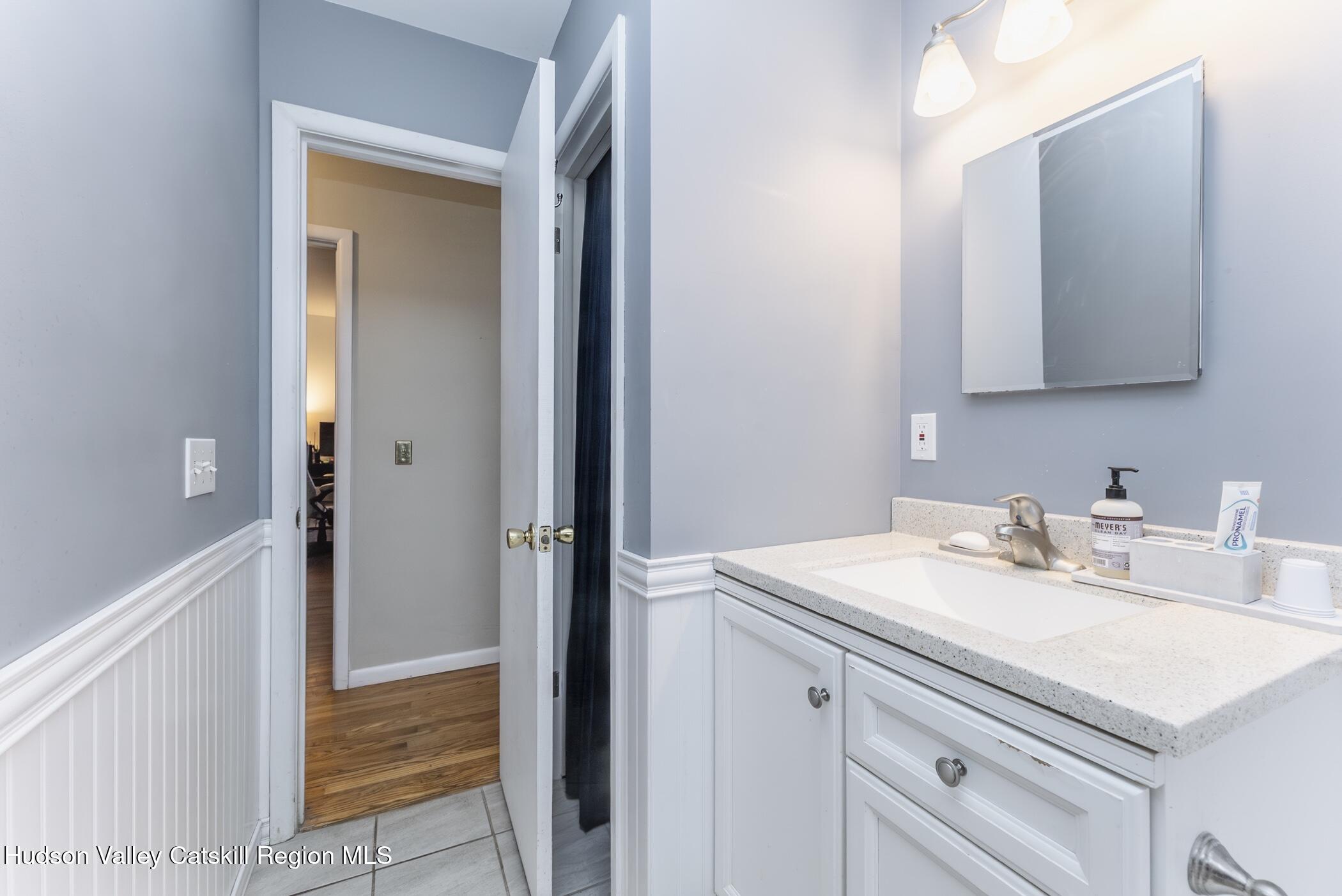 121 Rayna Street Hurley, NY 12443 - Photo 22 of 41 a bathroom with a sink vanity and a mirror
