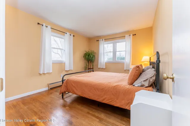 a livingroom with workspace and a window