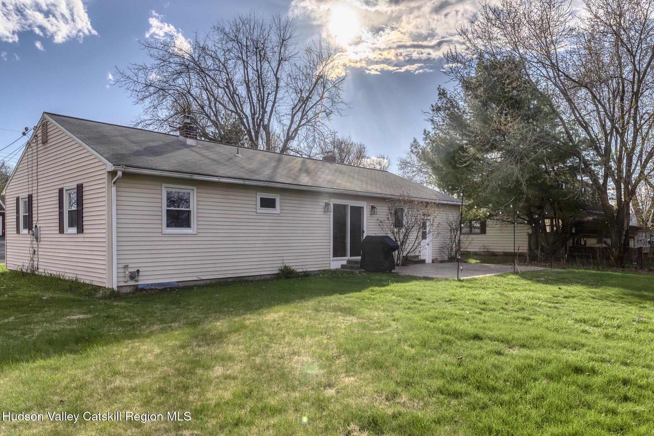 121 Rayna Street Hurley, NY 12443 - Photo 36 of 41 a view of a house with a yard and sitting area