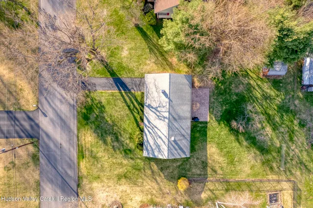 an aerial view of residential houses with outdoor space