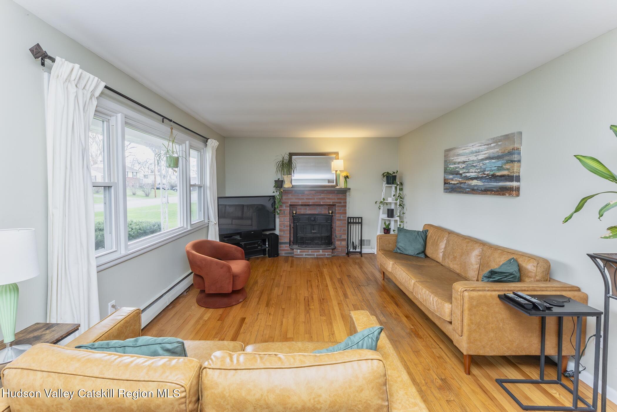 121 Rayna Street Hurley, NY 12443 - Photo 5 of 41 a living room with furniture and a fireplace