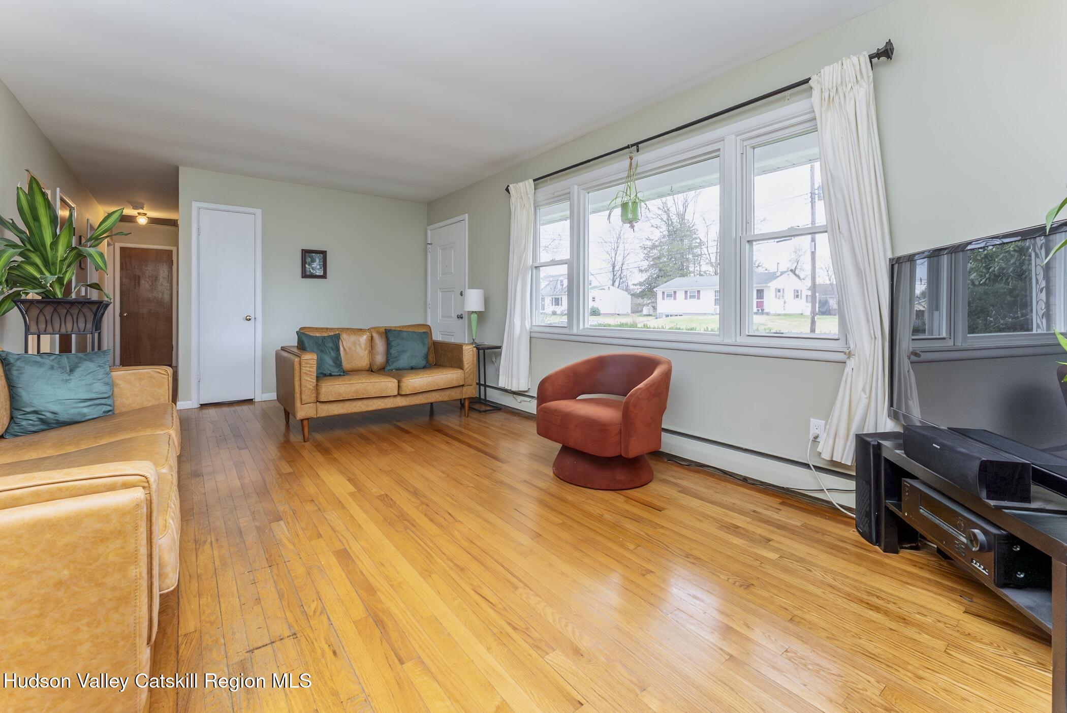 121 Rayna Street Hurley, NY 12443 - Photo 7 of 41 a living room with furniture and a large window