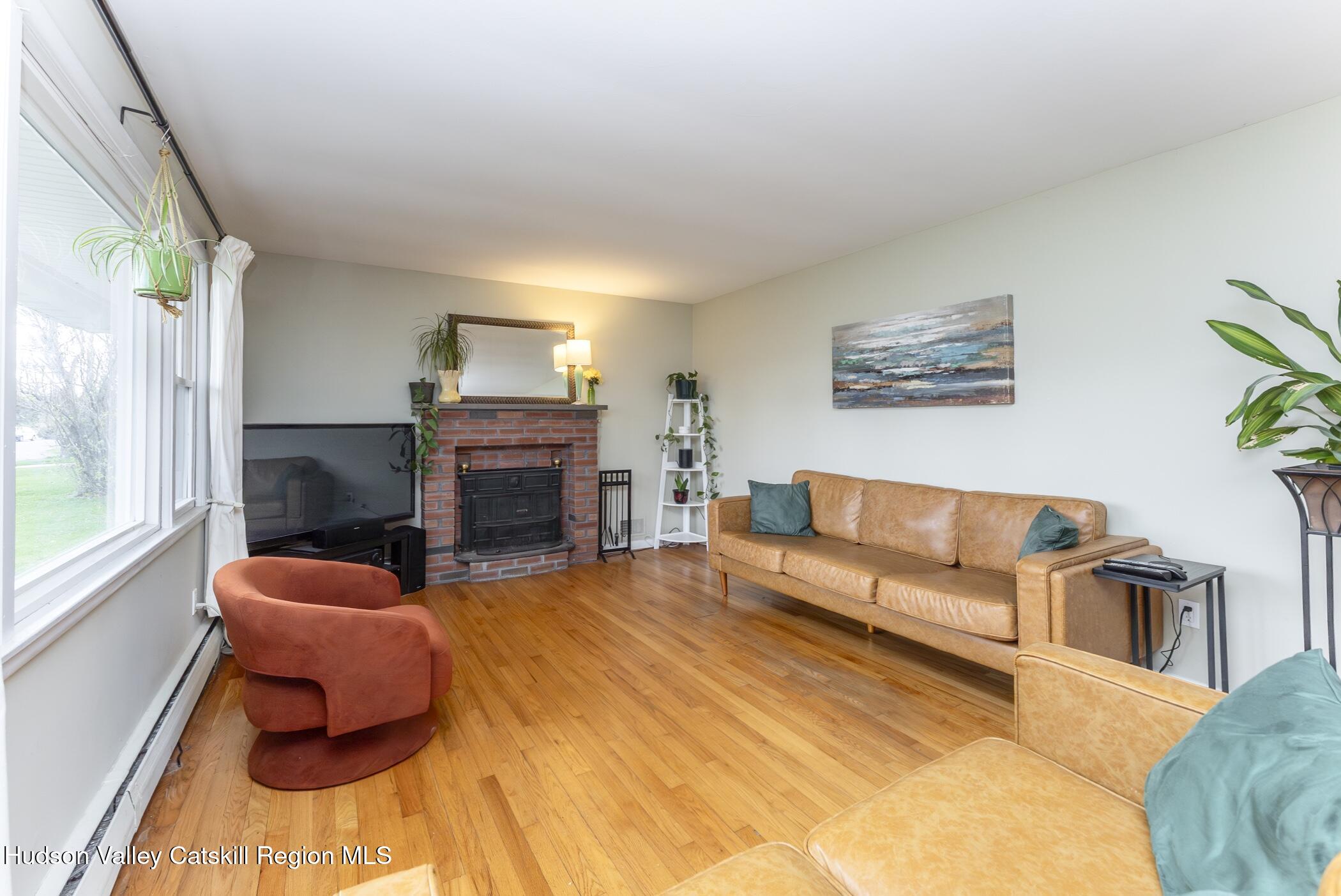 121 Rayna Street Hurley, NY 12443 - Photo 9 of 41 a living room with furniture and a fireplace