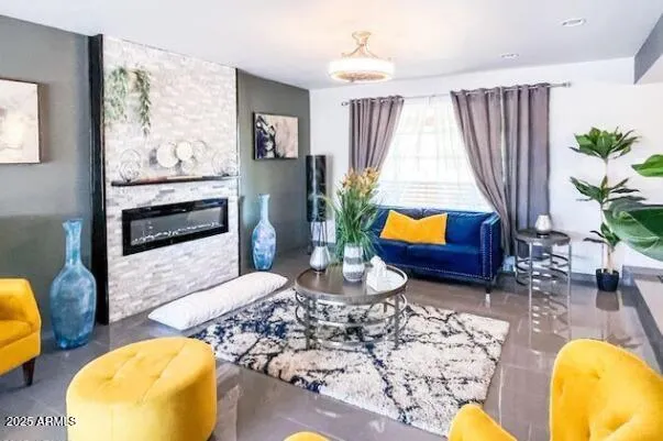 a living room with furniture and a painting on the wall