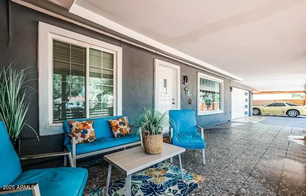a outdoor living space with furniture and a potted plant