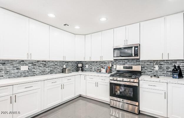 11215 North 37th Avenue Phoenix, AZ 85029 - Photo 13 of 46 a kitchen with appliances a sink and cabinets