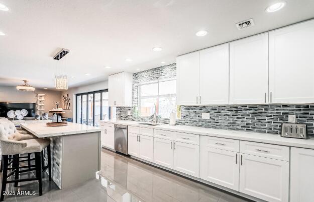 11215 North 37th Avenue Phoenix, AZ 85029 - Photo 14 of 46 a kitchen with a sink window and cabinets