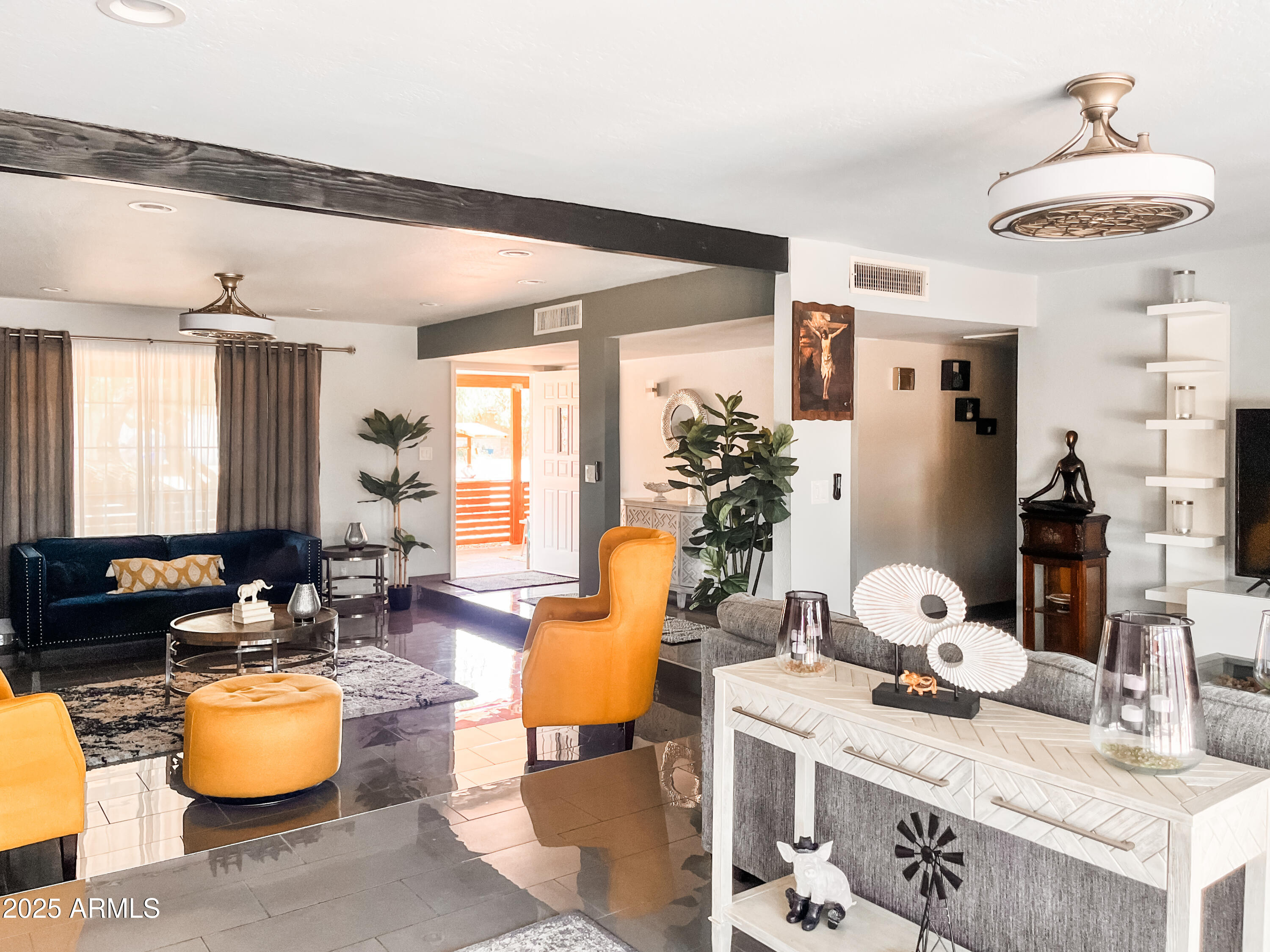 11215 North 37th Avenue Phoenix, AZ 85029 - Photo 25 of 46 a living room with furniture and a chandelier