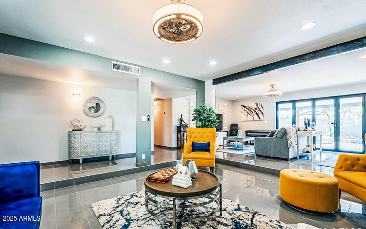 11215 North 37th Avenue Phoenix, AZ 85029 - Photo 26 of 46 a living room with furniture and a wooden floor