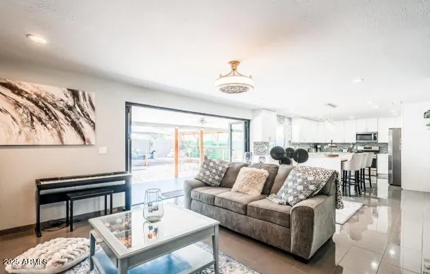 a living room with furniture and a large window