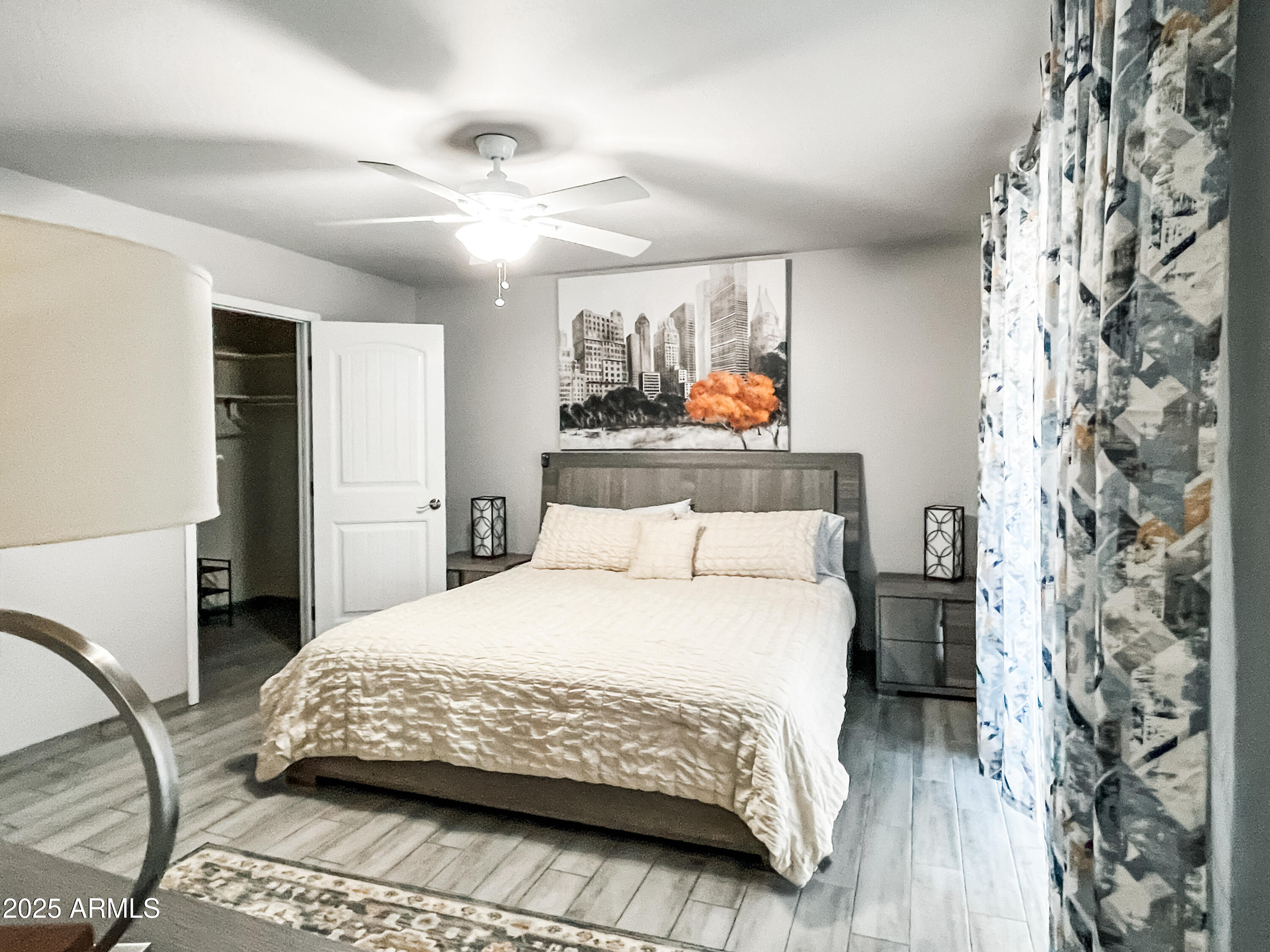 11215 North 37th Avenue Phoenix, AZ 85029 - Photo 33 of 46 a bedroom with a bed and a chandelier