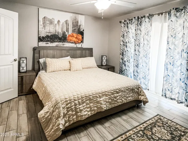 a bedroom with a bed and a window