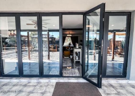 11215 North 37th Avenue Phoenix, AZ 85029 - Photo 5 of 46 a view of a hallway with wooden floor and a glass door