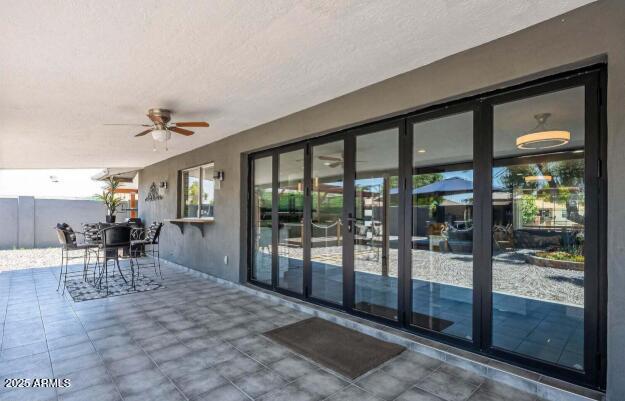 11215 North 37th Avenue Phoenix, AZ 85029 - Photo 10 of 46 a view of a dining room with furniture wooden floor and a chandelier