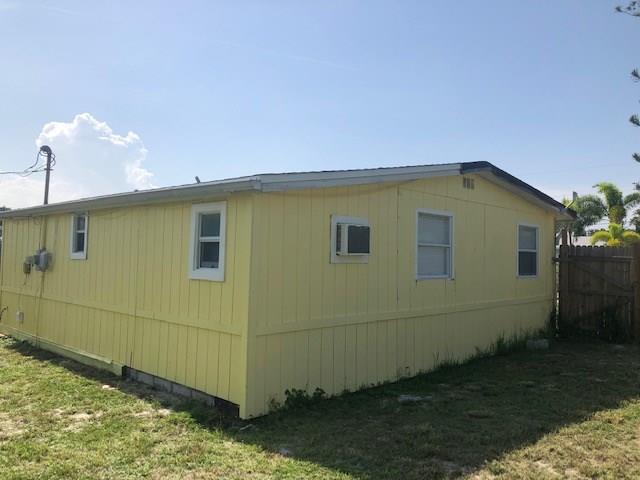 2234 Northeast Pine Ridge Street Jensen Beach, FL 34957 - Photo 15 of 16 a backyard of a house