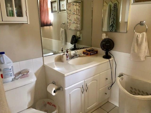 2234 Northeast Pine Ridge Street Jensen Beach, FL 34957 - Photo 5 of 16 a bathroom with a sink and toilet