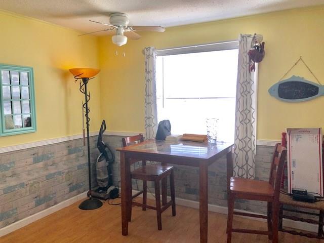 2234 Northeast Pine Ridge Street Jensen Beach, FL 34957 - Photo 10 of 16 a view of a dining room with furniture and a window