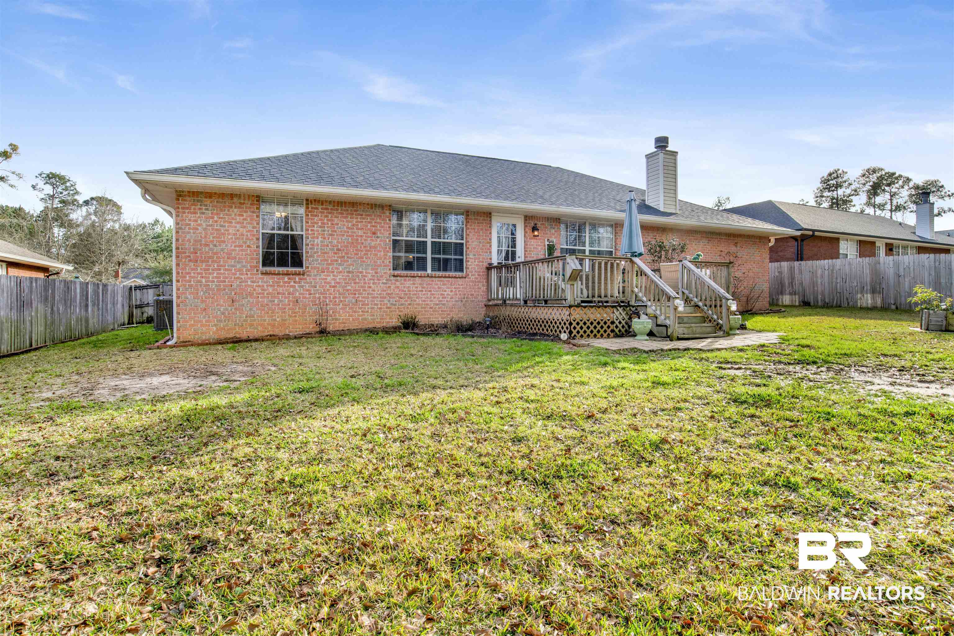 11697 Balsam Court Daphne, AL 36527 - Photo 27 of 31 Back of house with a wooden deck and a lawn