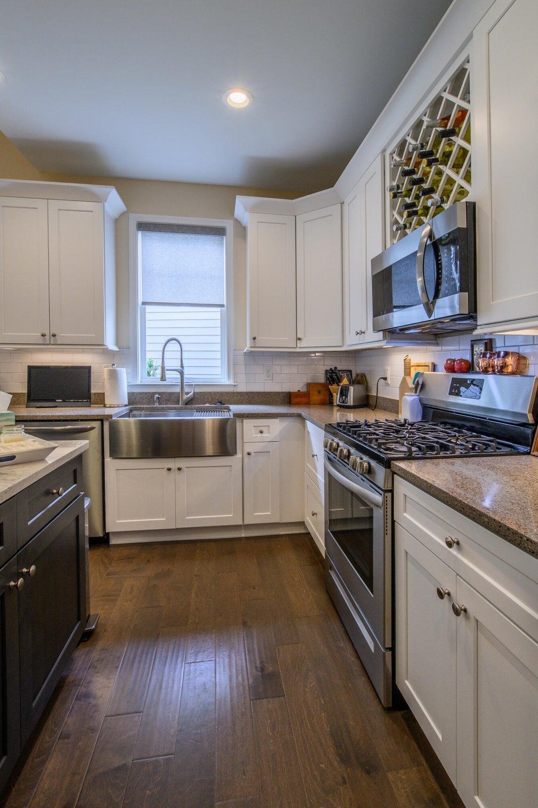 41 Chamberlain Loop Lexington, VA 24450 - Photo 12 of 43 a kitchen with stainless steel appliances granite countertop a stove a sink and a microwave