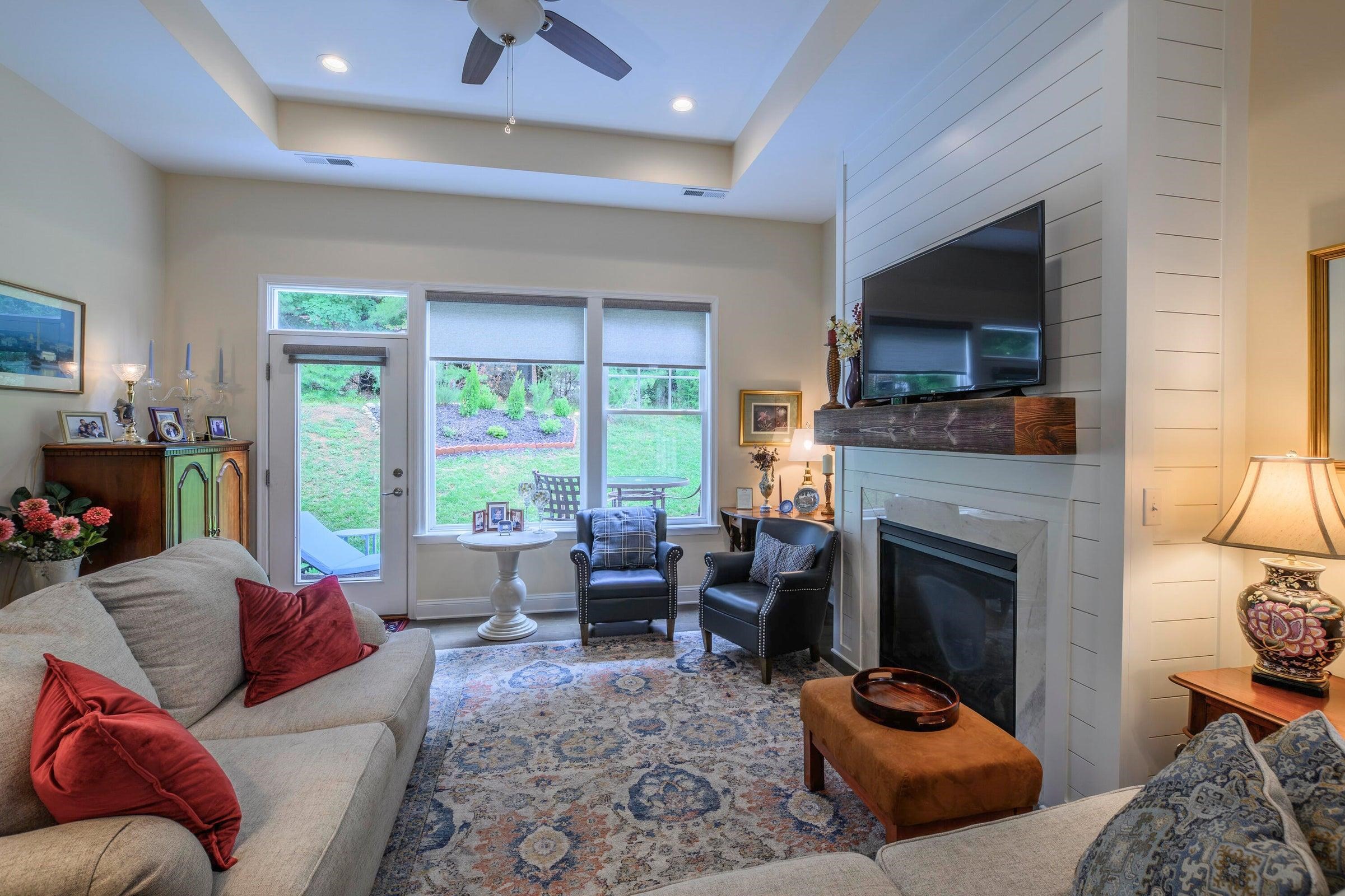 41 Chamberlain Loop Lexington, VA 24450 - Photo 19 of 43 a living room with furniture flat screen tv and a fireplace
