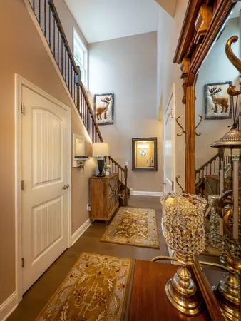 a kitchen with stainless steel appliances granite countertop a sink a stove a refrigerator and island