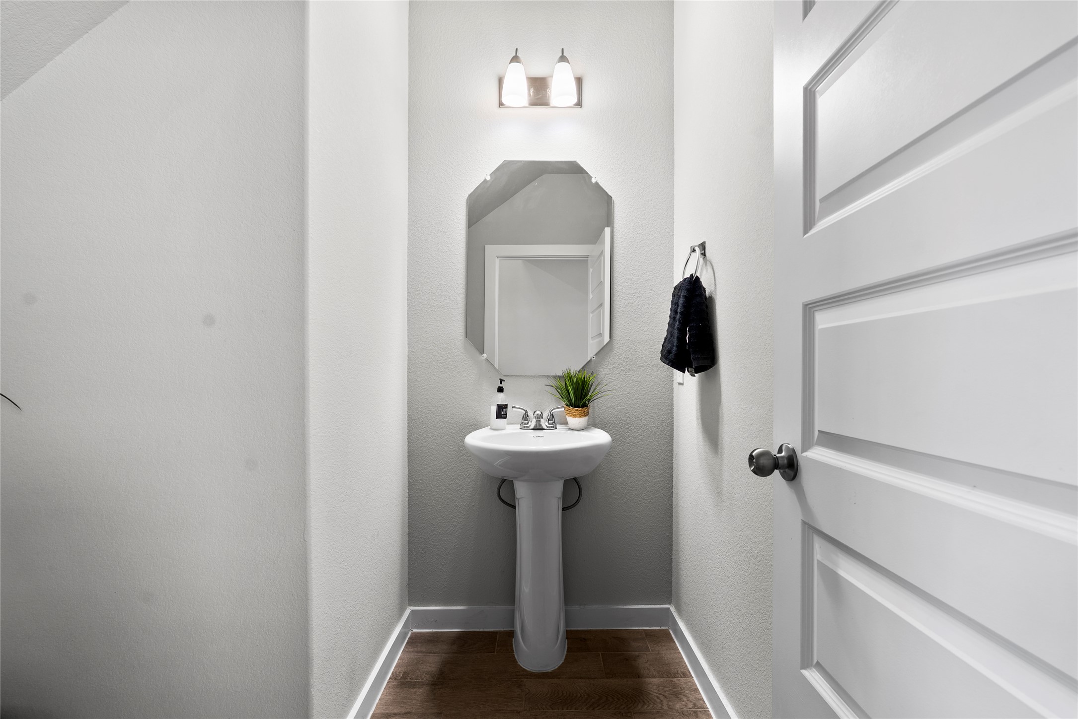 156 Appleberry Lane Elgin, TX 78621 - Photo 21 of 40 a view of a bathroom with a sink and mirror