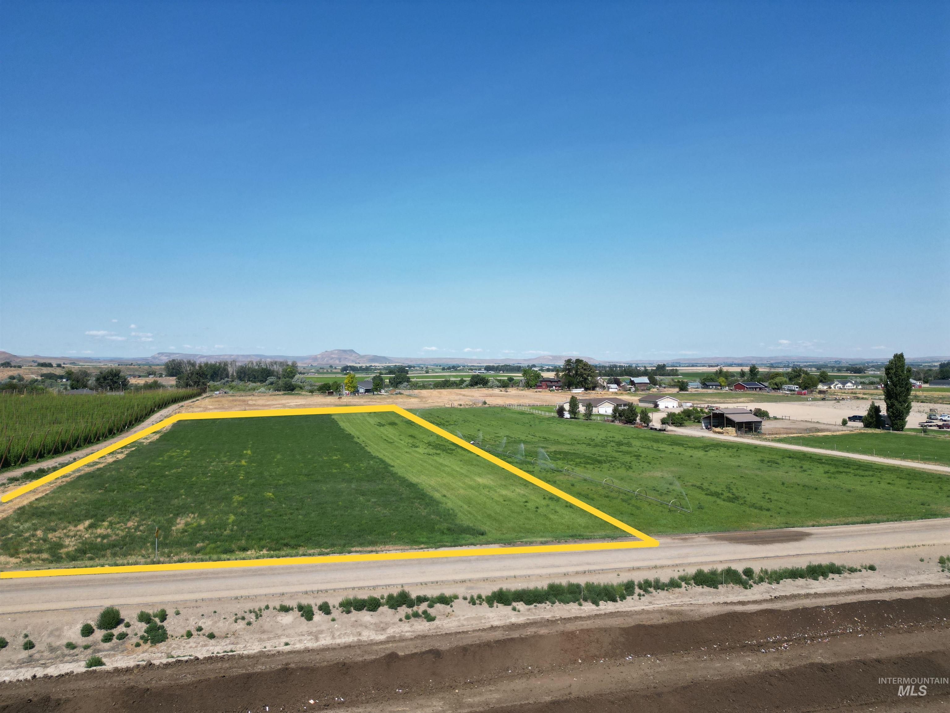 4.8-actbd Chips Lane Parma, ID 83660 - Photo 2 of 3 Aerial view of sparsely populated area with mountains and abundant farmland
