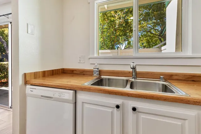 a kitchen with a sink and a window