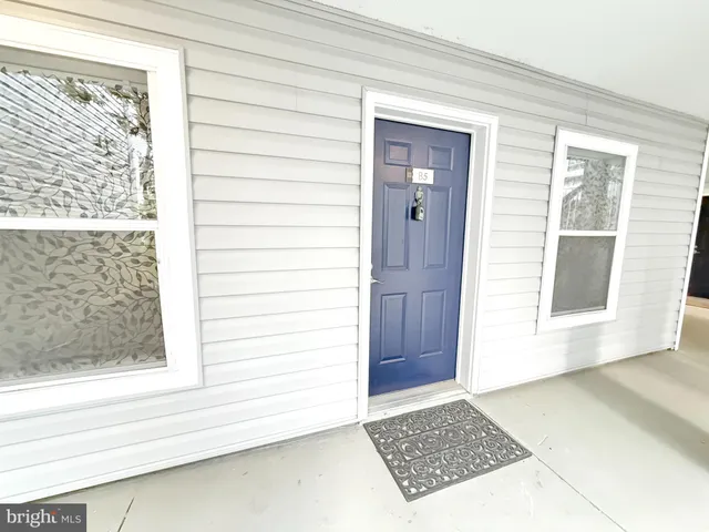a view of a door and a window