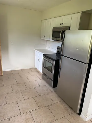 a utility room with washer and dryer