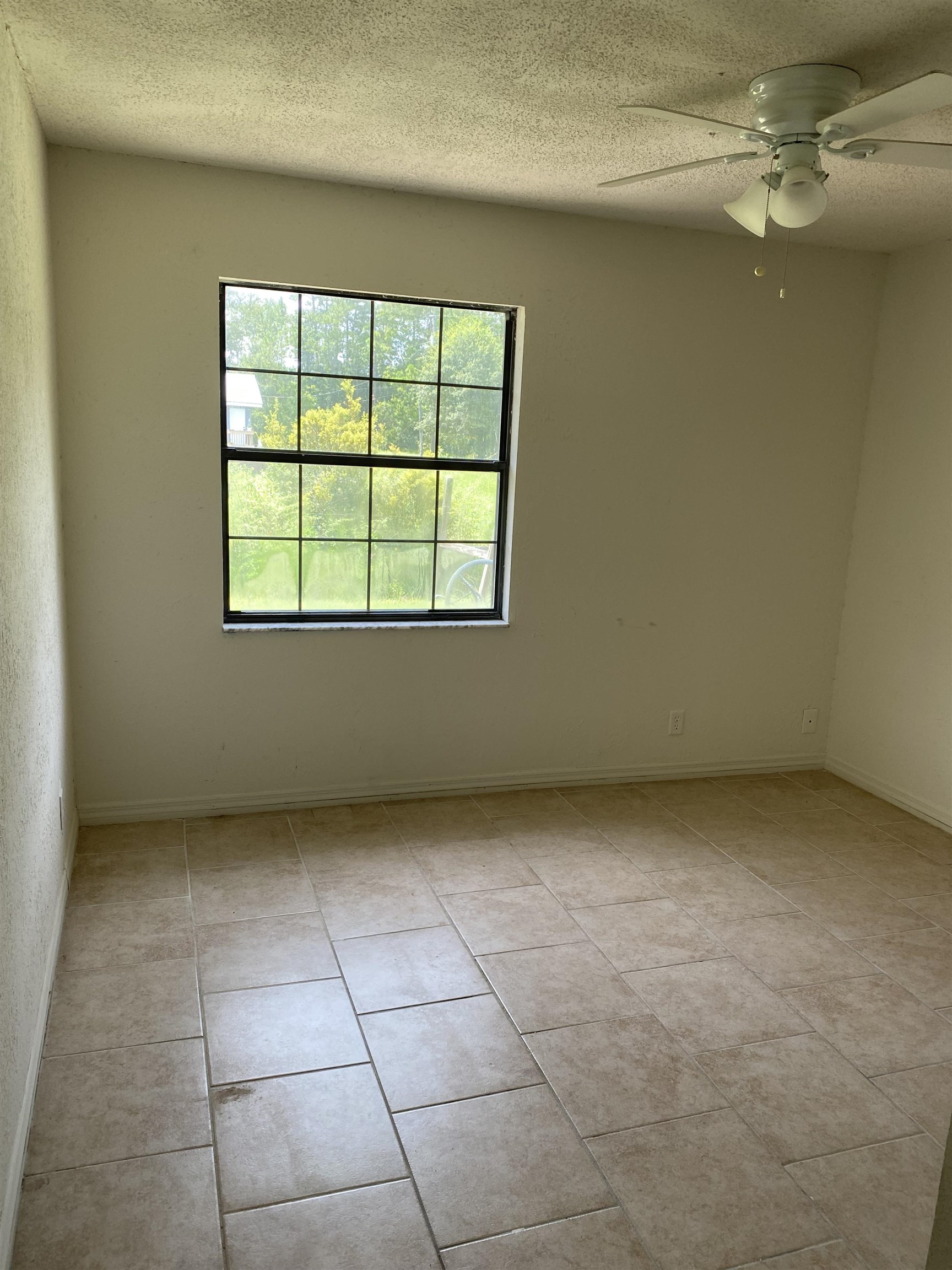 1880 Adams Acres Road St. Augustine, FL 32084 - Photo 5 of 7 an empty room with a empty space and windows