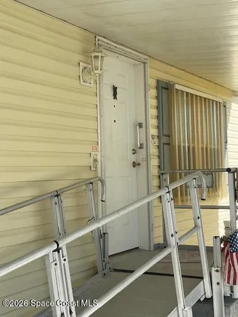 a bathroom with a shower and a glass door